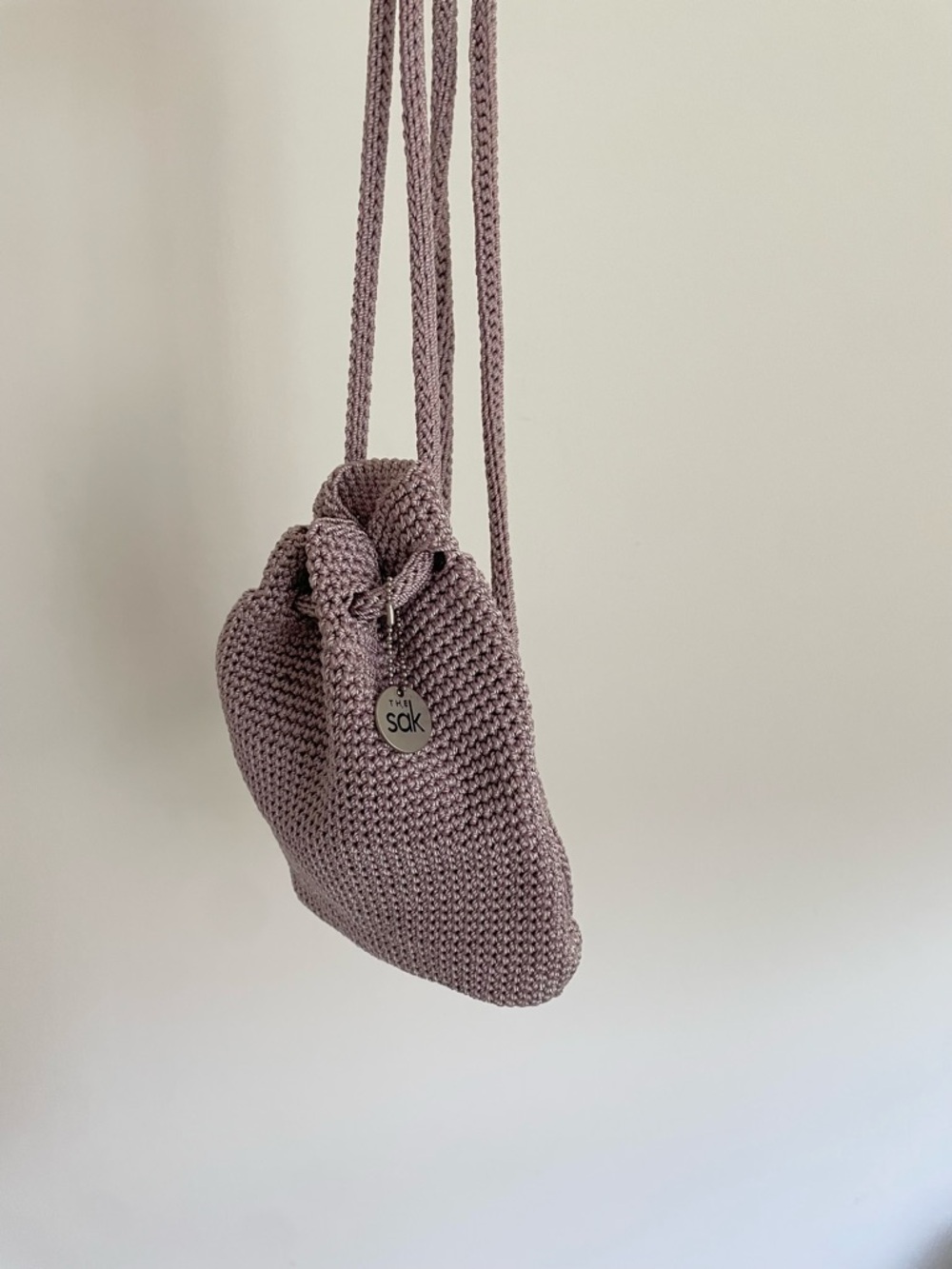 The Sak lavender crochet mini backpack